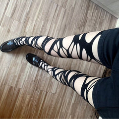 hollow out irregular tights